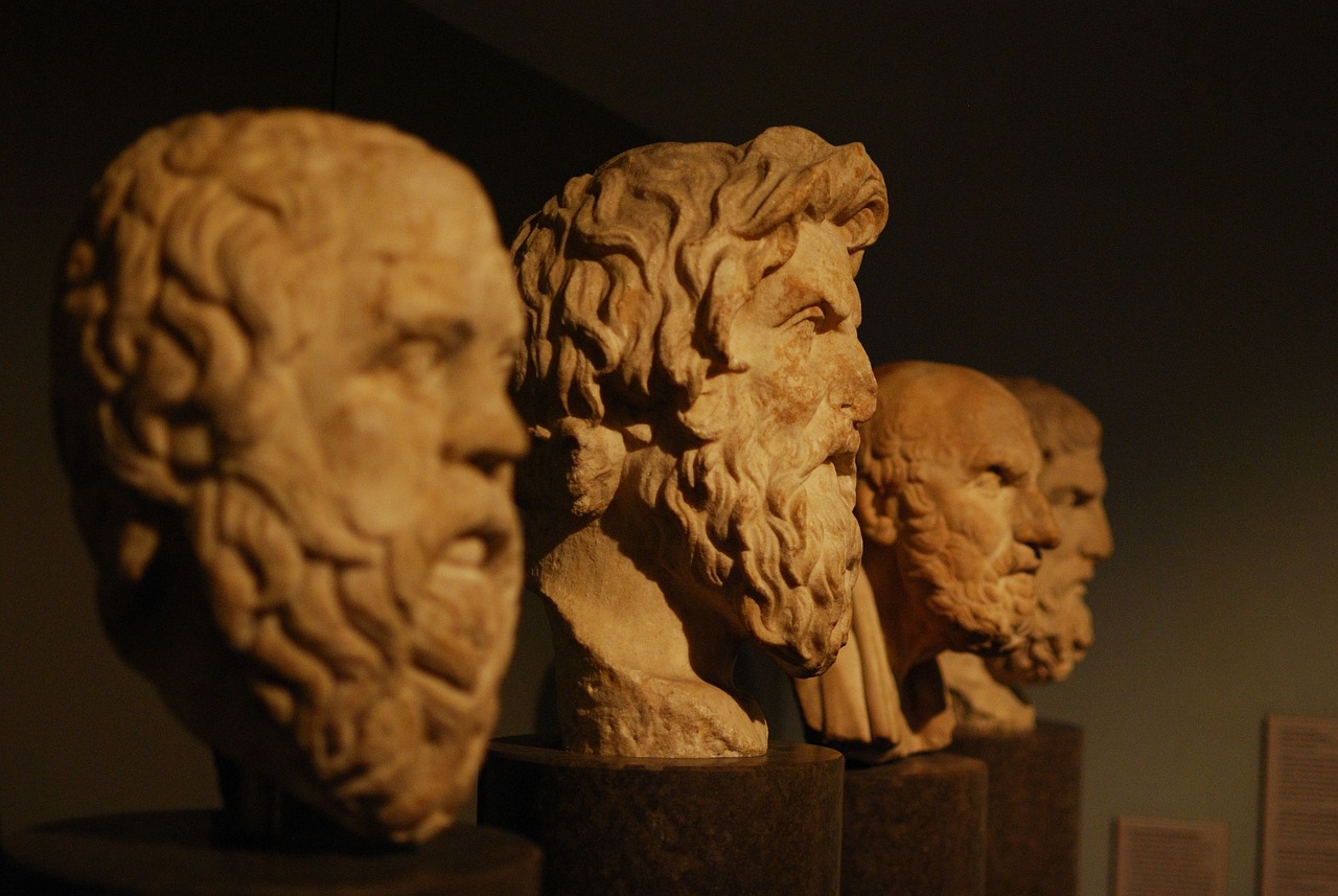 four busts of philosophers featuring Aristotle